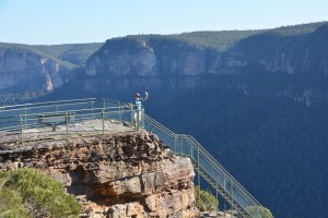 The late afternoon sun catches Julie on Pulpit Rock near Blackheath