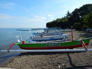 Fishing boats lined up on Lovina Beach patiently waiting for their next launch