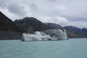 Moraine captured in the glacier and carried out by the ice berg forms a beautiful marble effect in the ice