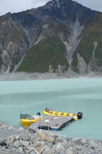 Our brightly colour boats create a contrast against the gray moraine and steep mountain walls