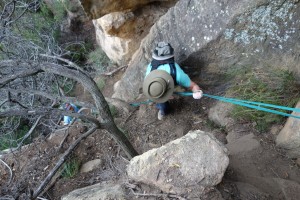 Julie using the tape to help negotiate a particularly vertical and difficult section