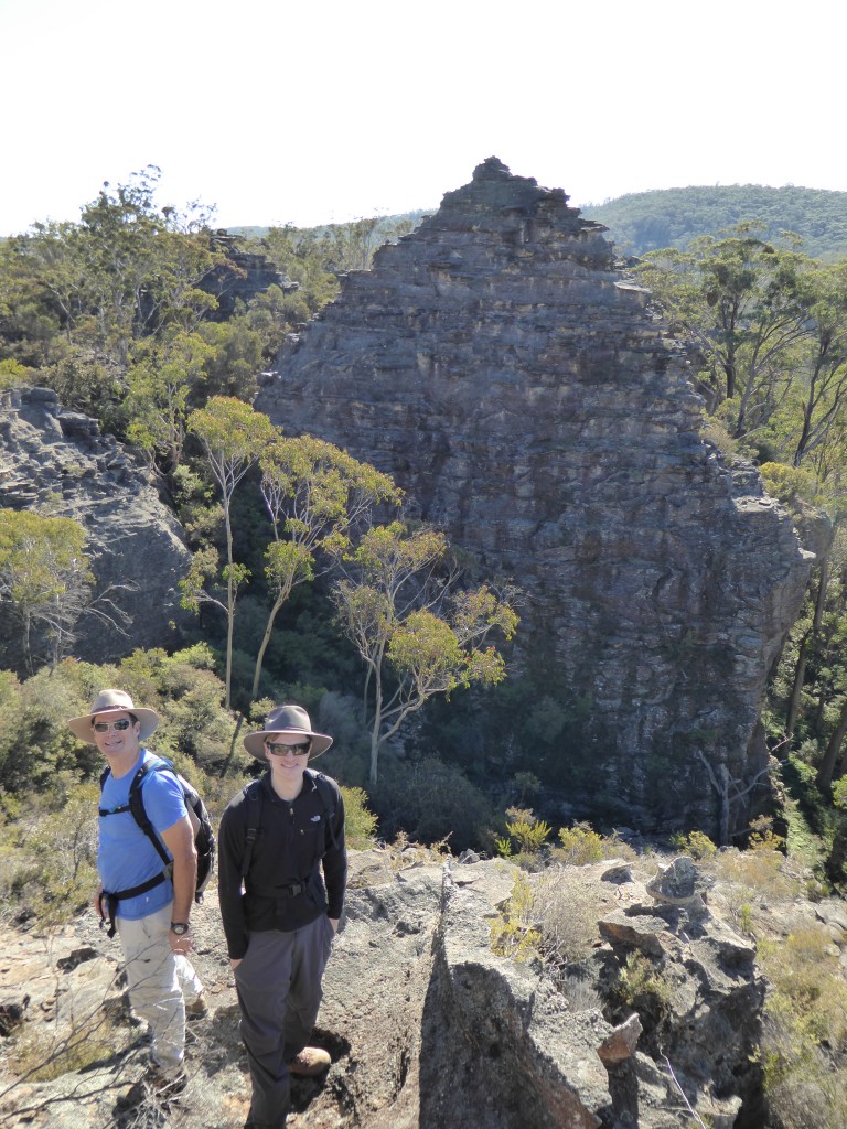 Father and son in front of  one of the many amazing pagoda rock formations that marks this area