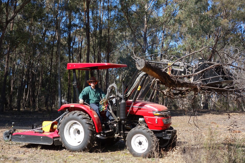 The Big Red Machine does the heavy lifting when we are clearing trees from our back paddock