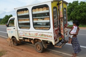 A bell attracts customers as the local bread truck passes through villages