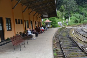 Julie resting her hiking legs at the Oliya train station 