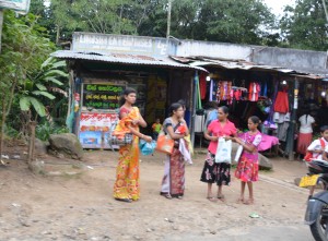 Some of the villagers wait for a local bus - hey, catch the train!