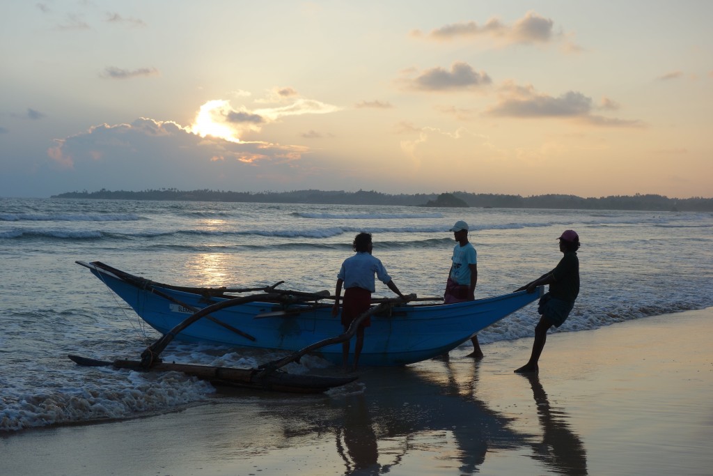 Late afternoon sun guides the fishermen back to their village after a full day fishing