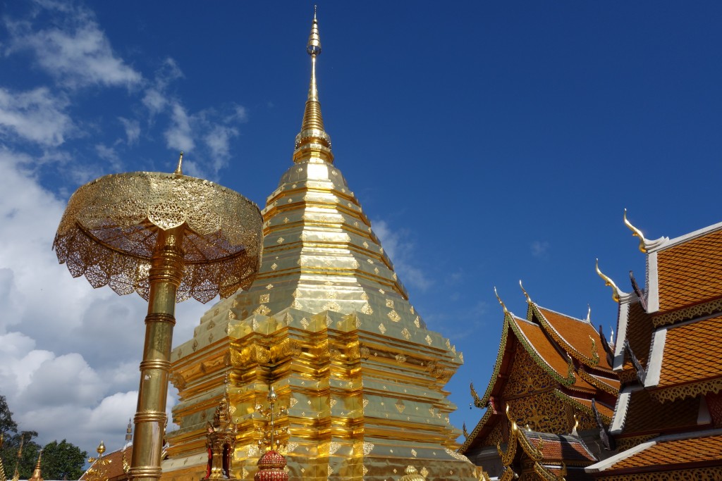 Doi Suthep glistens from the hot sun on the gold stupa and makes a spectacular setting on the mountain top above Chiang Mai