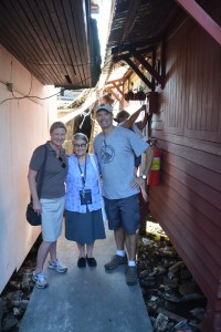 Julie and Bill with Sister Joan outside her humble home in the slums