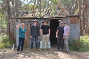 The team in front of an old miner's hut at Licking Hole