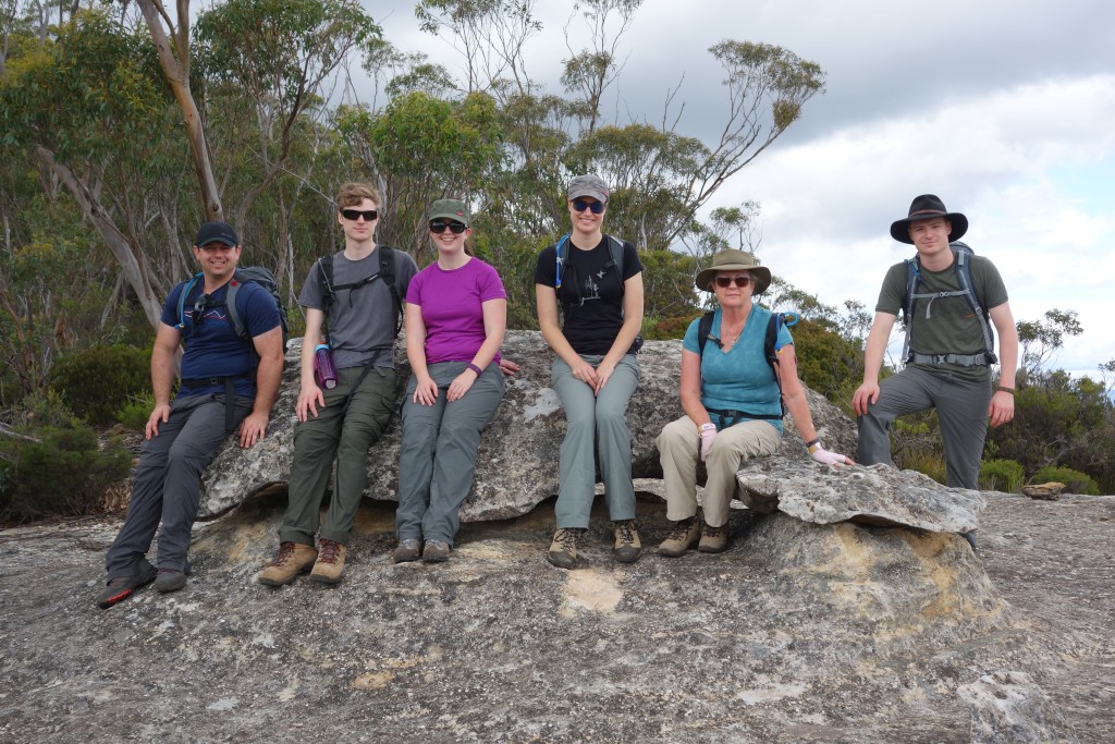 The whole team on a well earned rest on Whale Rock which rests on the spine of the Great Dividing Range