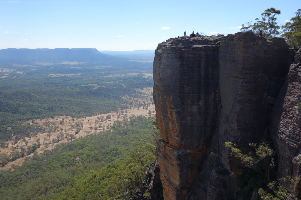 Feeling fairly small - some of our party on the edge of the escarpment with the valley far below