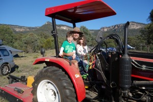 No Easter eggs hiding here - Brad and Alice climb up on the tractor while it has a flat tyre