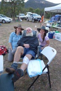 The paramedic and doctor posing with their patient after he earned six stitches