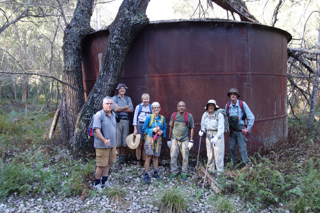 The team poses in front of an old water tank, a relic from the mining town of Newnes that stood here 100 years ago
