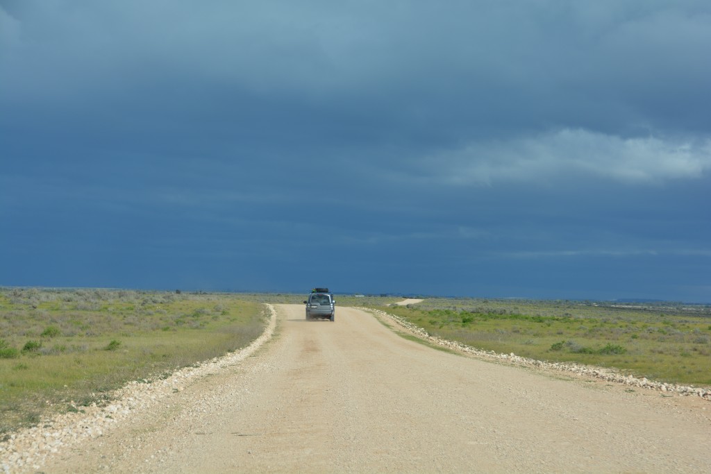 The long flat drive across little-used land with storm clouds brewing