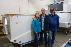 Julie and I with Marc, the founder and owner of XPCamper, in front of the shell of our camper during construction