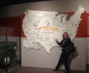 Julie posing in front of a large map showing the journey of John Steinbeck which later became the basis of one of his last books - Travels with Charlie 