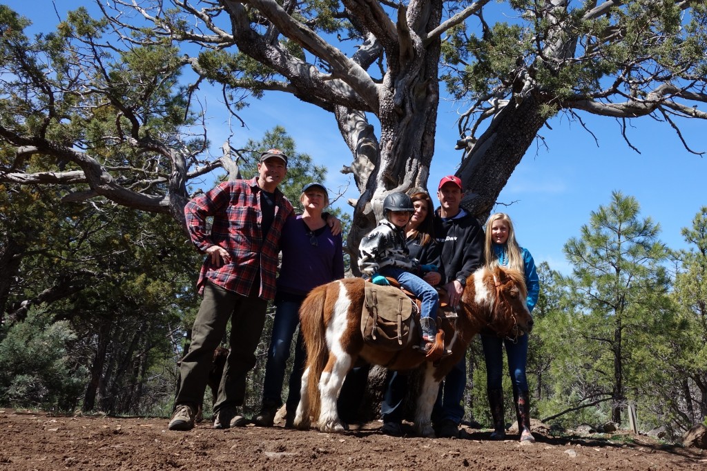 Team photo under a gnarly old juniper as we walk in the national forest behind Brush and Trish's remote home