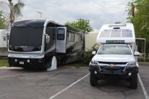 Tramp is dwarfed by one of the many huge RVs we see on the road