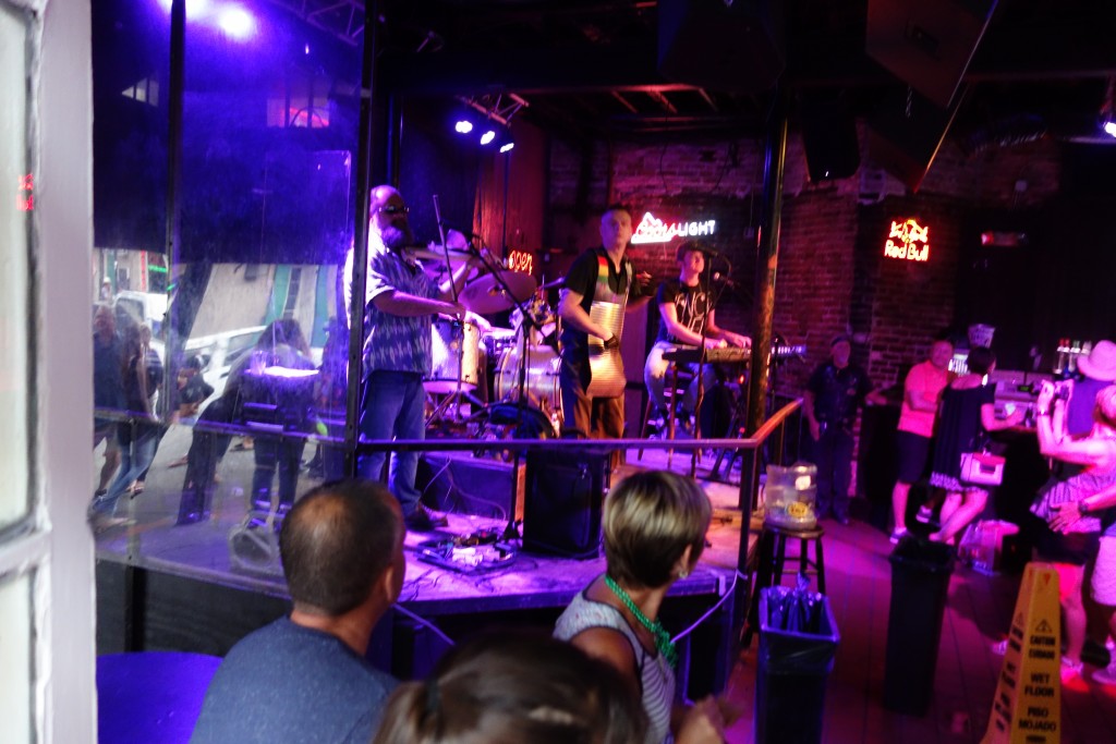 A zydeco band with a washboard player as lead singer