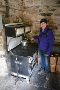 Julie trying out the cooking facilities in this 1930's cabin