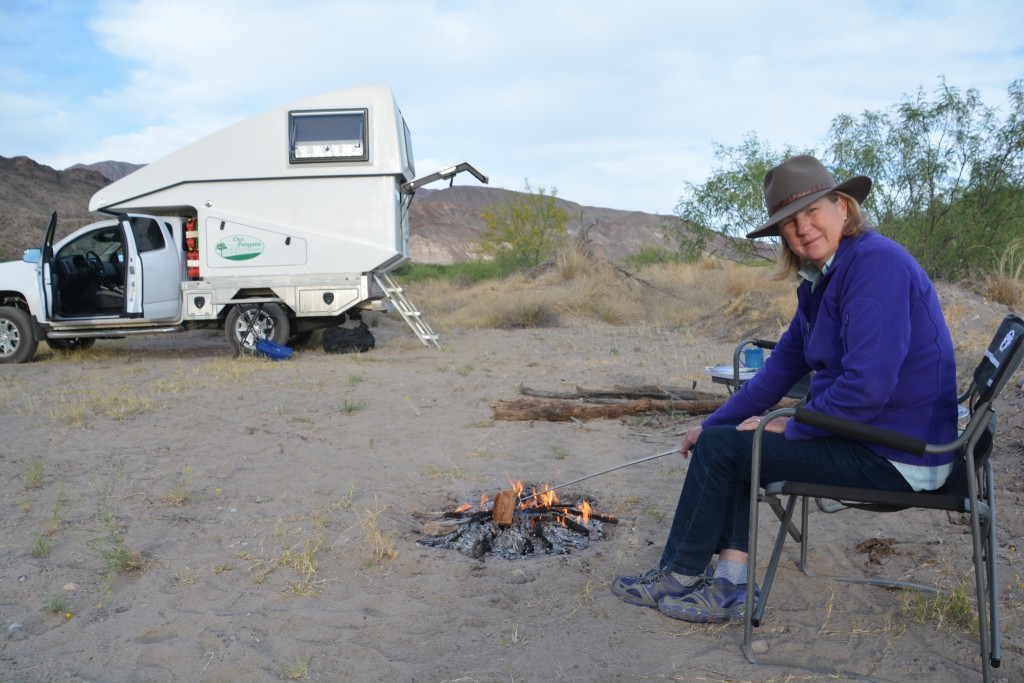 Julie using her new toaster at our campsite on the Rio Grande