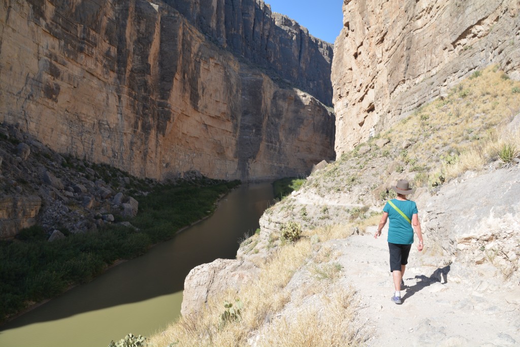 Julie negotiating the trail on a high ledge back in the canyon