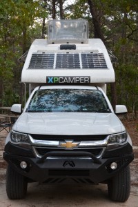 Tramp with his top up, the three solar panels in action and our skylight open for maximum ventilation