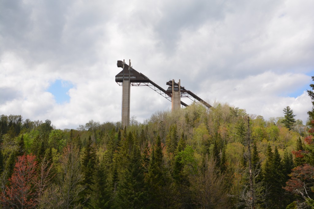 The huge ski jumps rise high above the trees