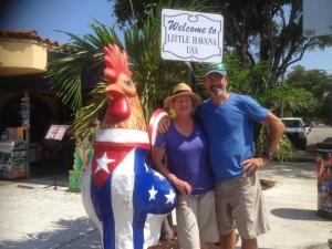 Roosters are a common theme in Florida and here's Julie in between a couple of them in Little Havana