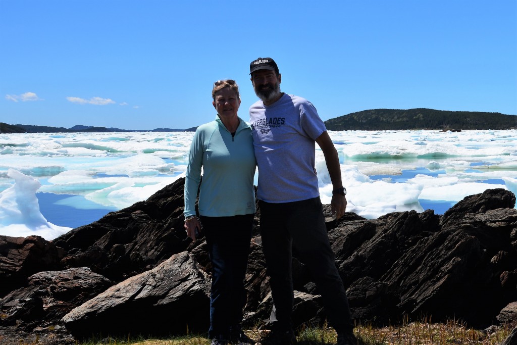 Icebergs with blue skies and thin clothes - quite a novelty...until the dark storm clouds moved in