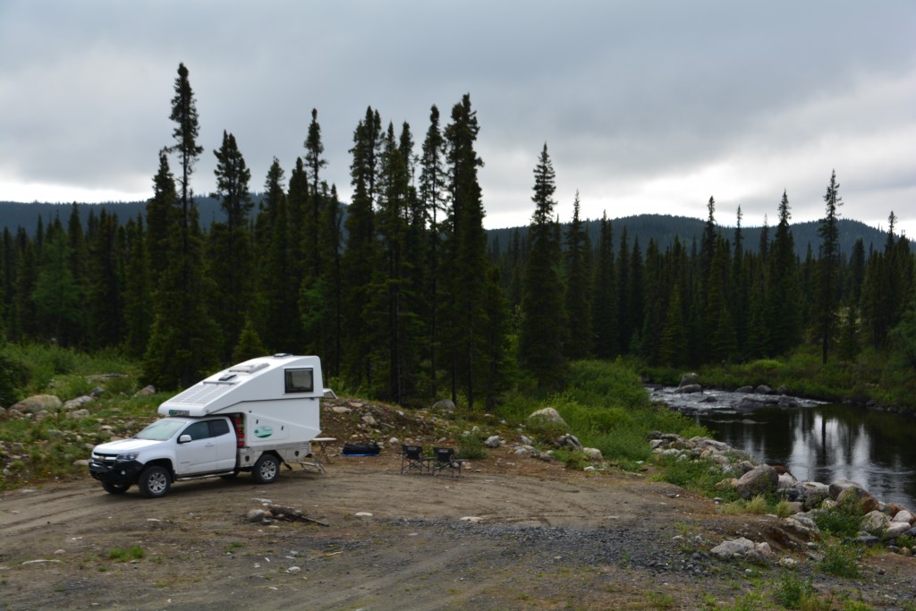 Our last campsite in Labrador - a beautiful little stream, an abandoned mining rail line and killer insects