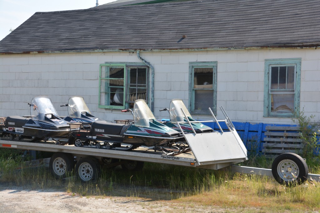 A normal back yard in Yellowknife - either a boat, skidoos or an ATV