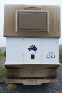 The long muddy roads made a mess of Tramp but when we lifted the camper the Aussie flag shined