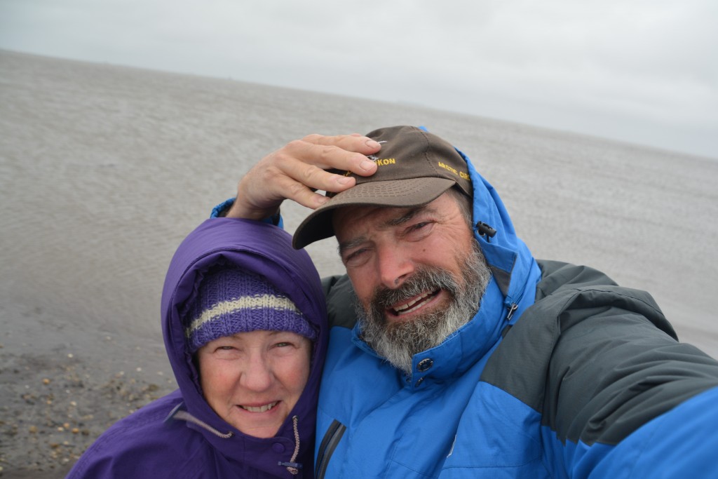 We made it! Behind us through the gloomy weather is the grey waters of the Arctic Ocean!