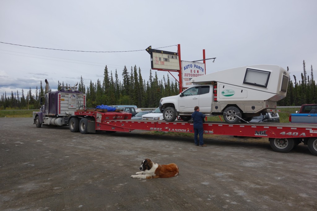 Tramp loaded on an even bigger trailer for its long ride back up to Fairbanks Tiny supervises in the foreground