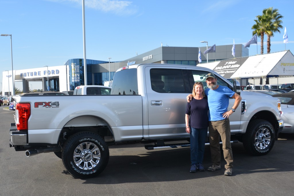 Julie and I pose in front of our new Ford F250 - a big truck, bigger than we thought we would ever buy but the right solution for the next stage of our travels