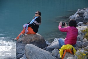 Chinese tourists compete for wearing the most number of different colours and posing for the best photos